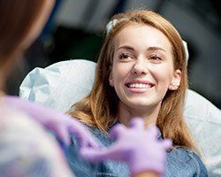 Woman in dental chair smiling