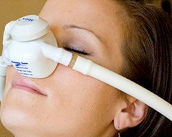 Woman wearing nitrous oxide nasal mask