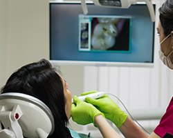 Dentist and patient looking at intraoral images