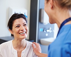 Patient in Dallas talking to dentist