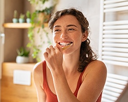 Patient in Dallas brushing their teeth