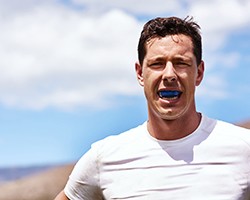 Patient in Dallas wearing a mouthguard