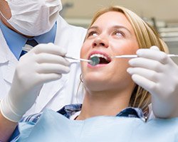 Woman receiving dental exam