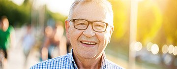 Smiling older man outdoors