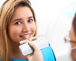 young woman getting veneers in Highland Park