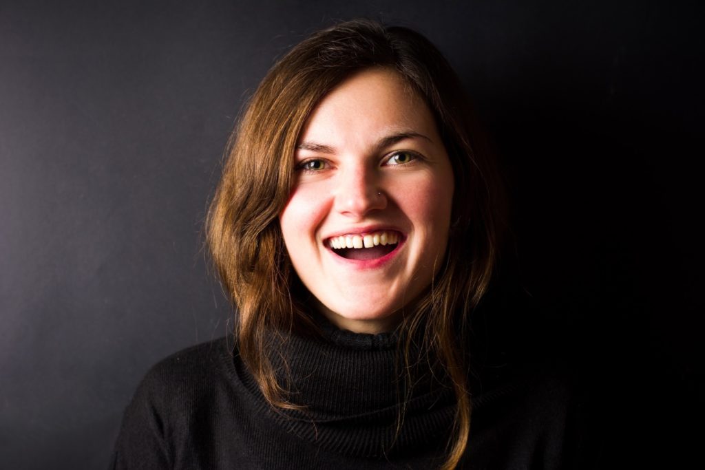 Woman with a gap between her front teeth before seeing a cosmetic dentist